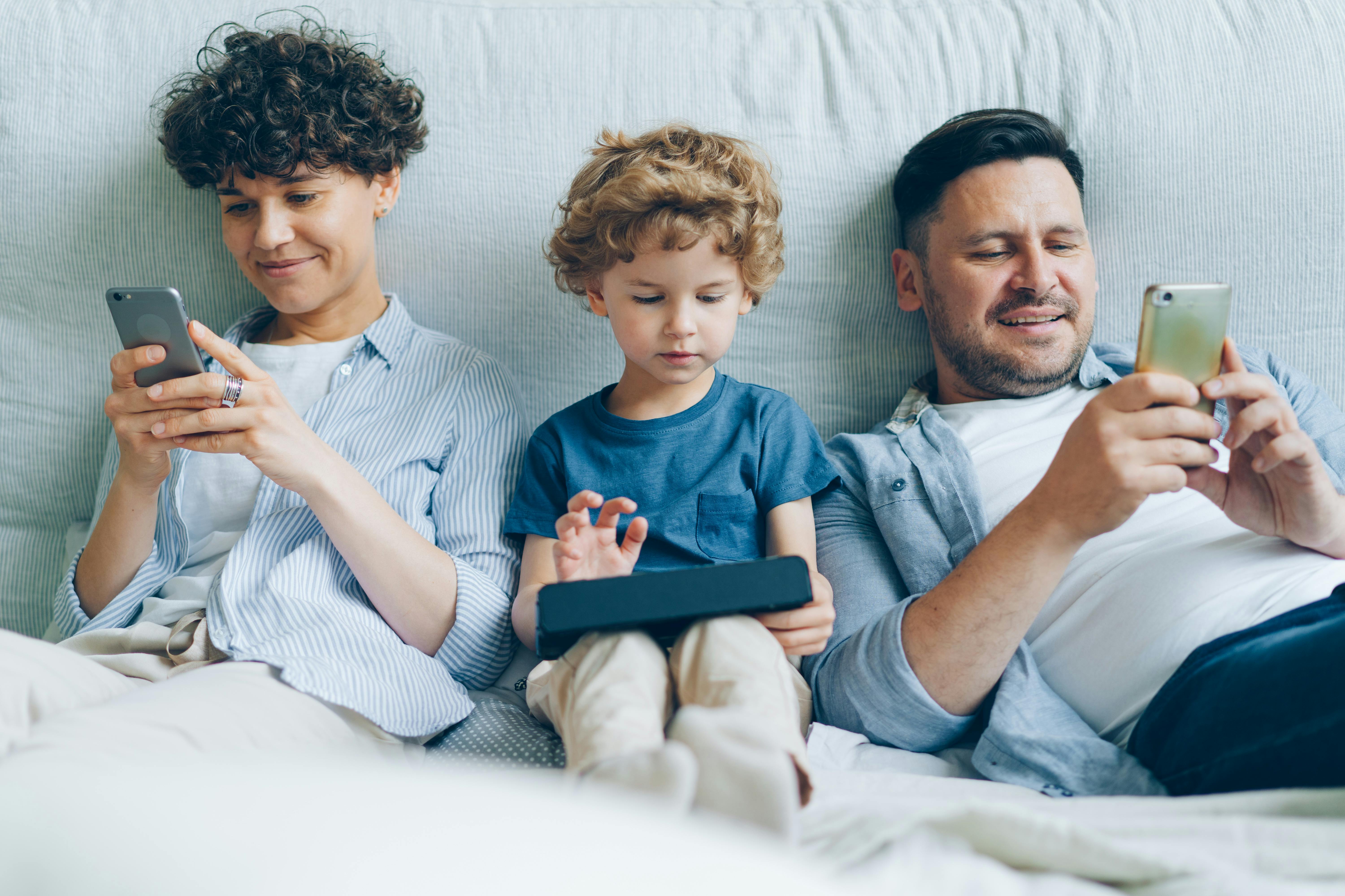 Family enjoying Wi-Fi on all devices at home